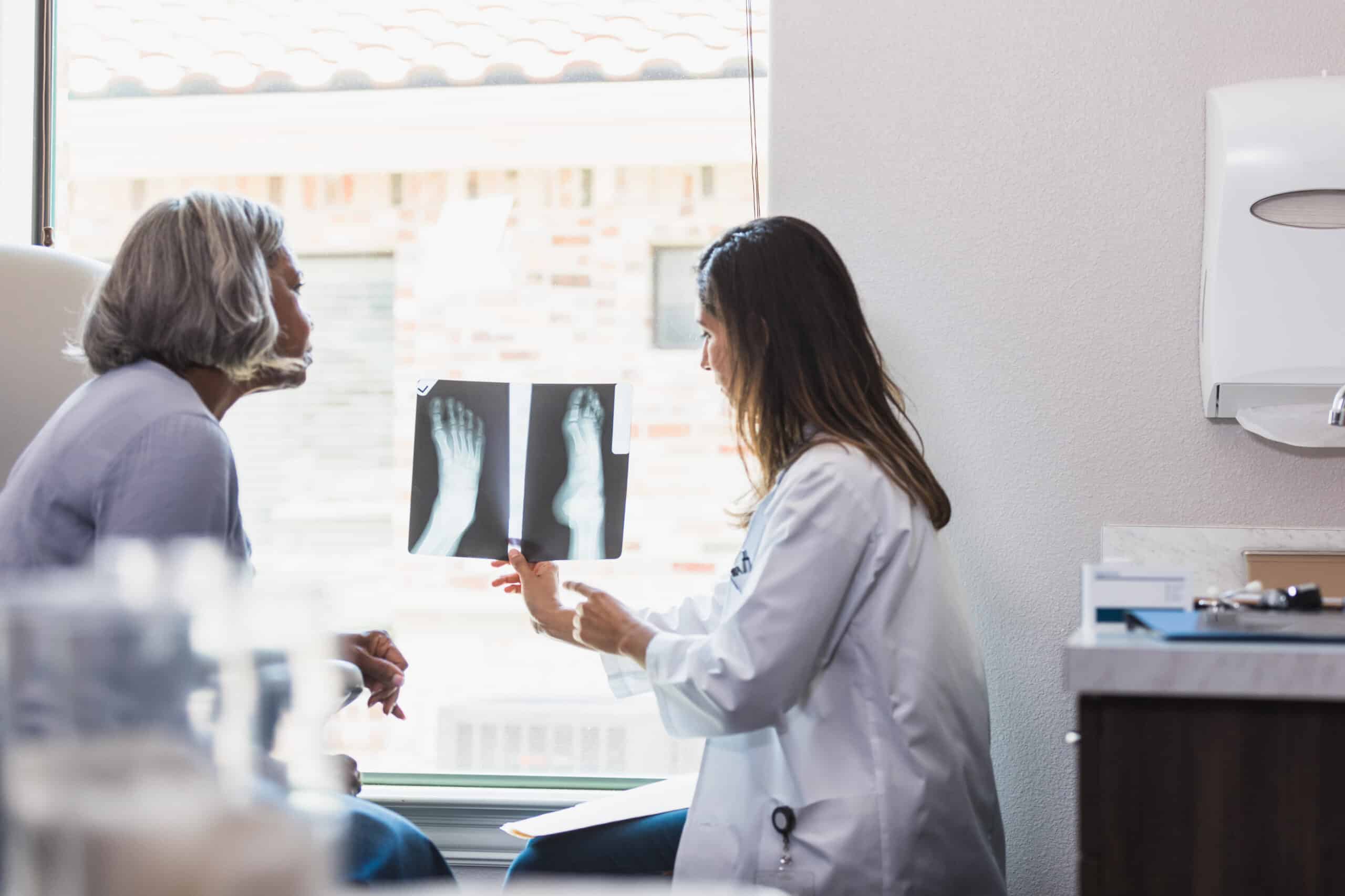Doctor examining a foot x ray